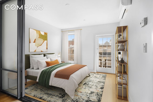 204 W 140th St Unit 4D, New York City, NY 10030 - bedroom with an AC wall unit and wood finished floors