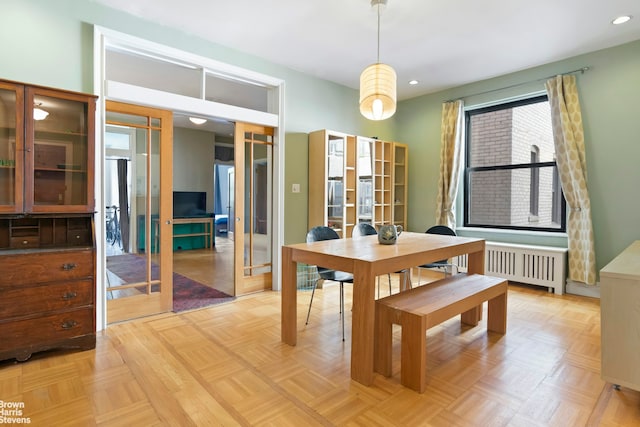109 Seaman Ave Unit 4A, New York City, NY 10034 - dining space with radiator heating unit, french doors, and recessed lighting