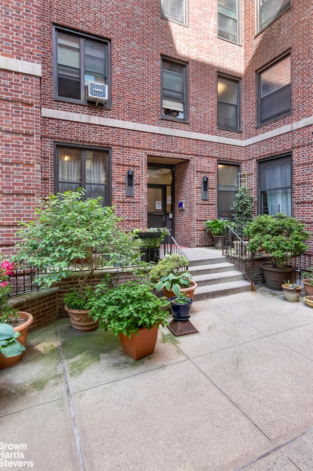 109 Seaman Ave Unit 4A, New York City, NY 10034 - property entrance with brick siding and cooling unit