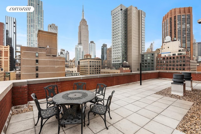 127 E 30th St Unit 11B, New York City, NY 10016 - view of patio featuring a skyline view and outdoor dining space