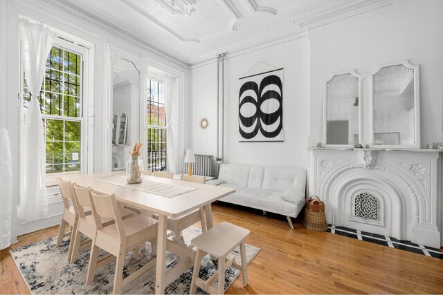 638 Monroe St, New York City, NY 11221 - dining area with ornamental molding and wood finished floors