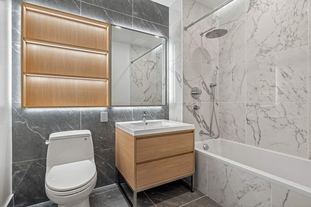 45-30 Pearson St Unit 6F, New York City, NY 11101 - bathroom featuring vanity, tile walls, toilet, and a combined bath / shower with marble appearance