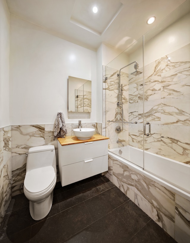 136 Powers St Unit 1G, New York City, NY 11211 - full bathroom featuring tile walls, tiled shower / bath combo, vanity, toilet, and recessed lighting