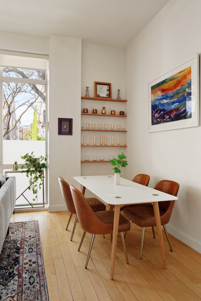 136 Powers St Unit 1G, New York City, NY 11211 - dining space with light wood-type flooring and baseboards