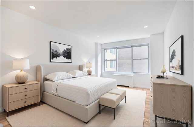 77 W 55th St Unit 4B, New York City, NY 10019 - bedroom featuring light wood-style flooring and recessed lighting