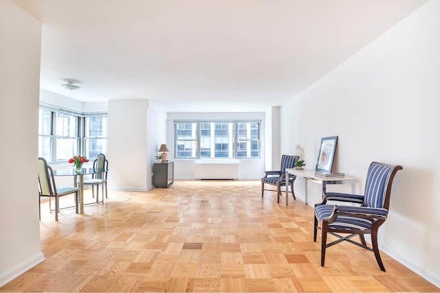 77 W 55th St Unit 4B, New York City, NY 10019 - living area featuring plenty of natural light and radiator