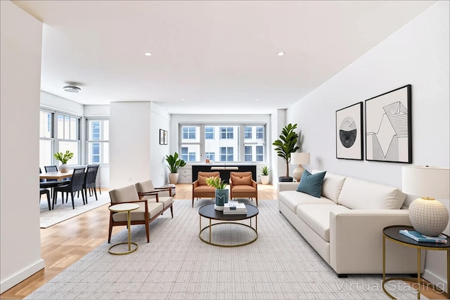 77 W 55th St Unit 4B, New York City, NY 10019 - living room with plenty of natural light, light wood-style floors, and recessed lighting