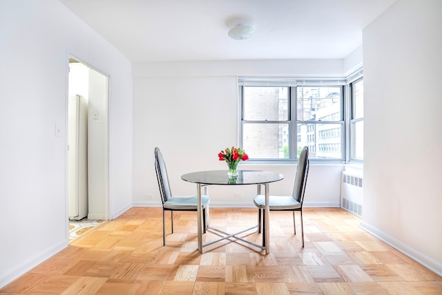 77 W 55th St Unit 4B, New York City, NY 10019 - dining space with radiator and baseboards