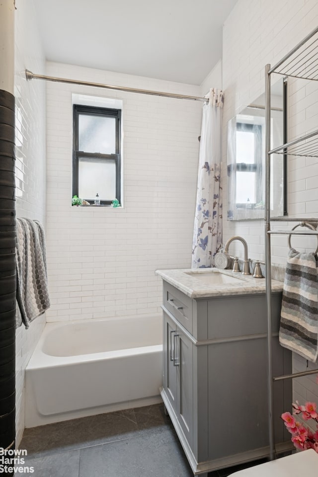 61-09 39th Ave Unit N4, New York City, NY 11377 - bathroom featuring vanity, shower / bath combo with shower curtain, and tile patterned floors