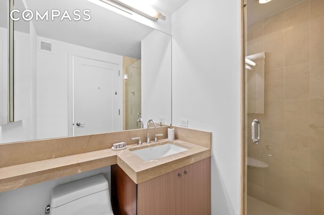 30 W St Unit 25G, New York City, NY 10004 - full bathroom featuring a stall shower, toilet, and vanity