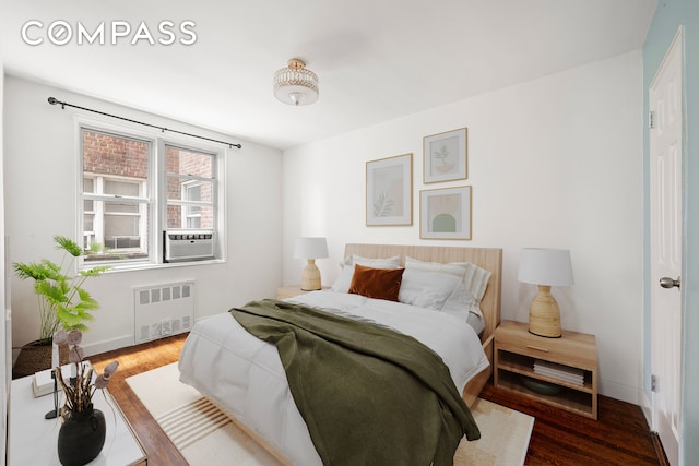 180 Van Cortlandt Park S Unit 4C, New York City, NY 10463 - bedroom with radiator, wood finished floors, baseboards, and cooling unit