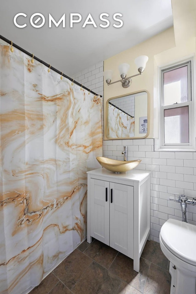 180 Van Cortlandt Park S Unit 4C, New York City, NY 10463 - bathroom with tile walls, vanity, a shower with curtain, and toilet