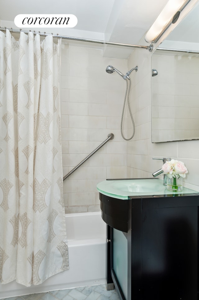 233 E 70th St Unit 8T, New York City, NY 10021 - bathroom featuring shower / bath combo with shower curtain and vanity