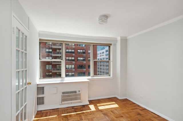 233 E 70th St Unit 8T, New York City, NY 10021 - unfurnished room featuring a wall mounted AC, ornamental molding, and baseboards