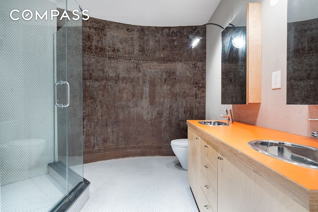 37 Bridge St Unit 1F, New York City, NY 11201 - full bathroom featuring a shower stall, double vanity, and toilet