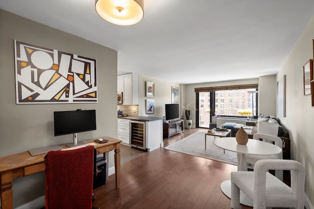 201 W 70th St Unit 15G, New York City, NY 10023 - living area with beverage cooler, dark wood-style flooring, and an office area