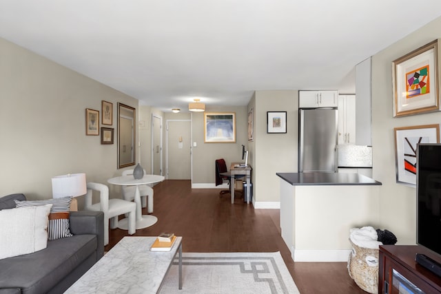 201 W 70th St Unit 15G, New York City, NY 10023 - living room featuring dark wood-style floors and baseboards