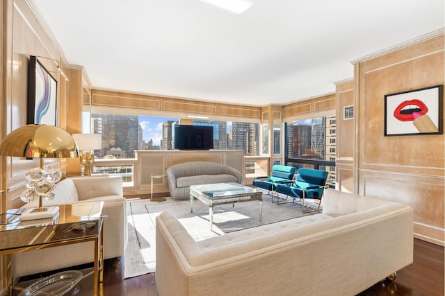 721 5th Ave Unit 39A, New York City, NY 10022 - living room featuring dark wood-style floors, crown molding, and a decorative wall