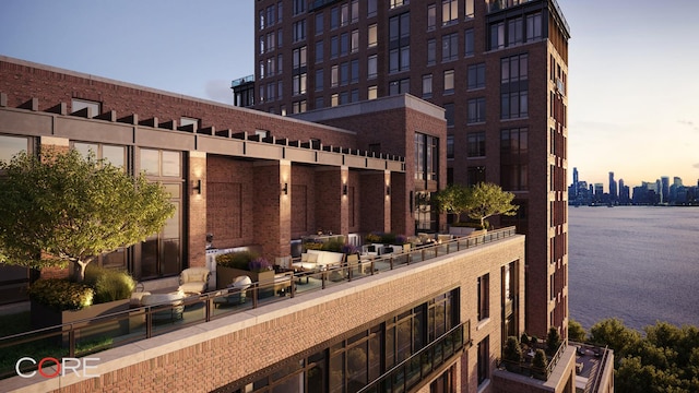 555 W 22nd St Unit 11Fe, New York City, NY 10011 - patio terrace at dusk with a water view