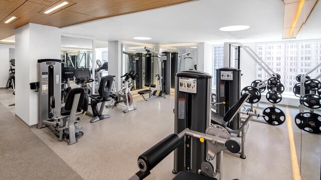 150 W 56th St Unit 3104, New York City, NY 10019 - exercise room featuring wood ceiling