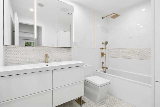 142 Skillman Ave Unit 2B, New York City, NY 11211 - full bathroom featuring toilet, tiled shower / bath, vanity, tile patterned flooring, and decorative backsplash