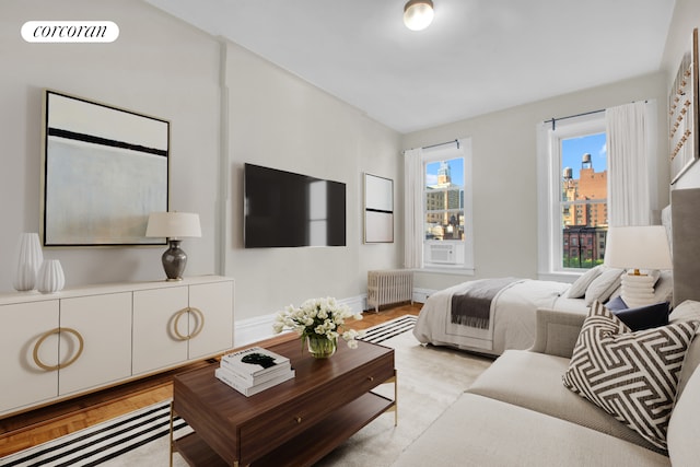 226 E 27th St Unit 5C, New York City, NY 10016 - bedroom with radiator and light wood finished floors