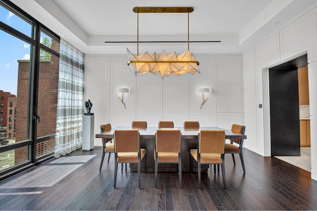 155 W 11th St Unit 4G, New York City, NY 10011 - dining room featuring dark wood-style flooring and a decorative wall