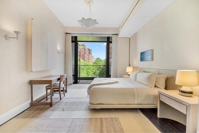 155 W 11th St Unit 4G, New York City, NY 10011 - bedroom with access to exterior and a chandelier