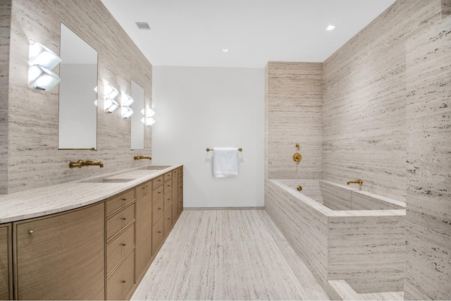 155 W 11th St Unit 4G, New York City, NY 10011 - full bath featuring double vanity, a bath, tasteful backsplash, and wood finished floors