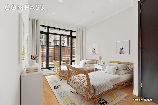309 2nd St Unit 2F, New York City, NY 11215 - bedroom featuring multiple windows, light wood-style flooring, and recessed lighting