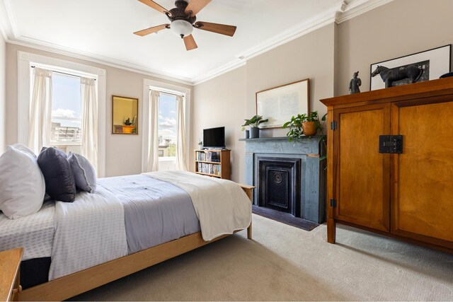 208 Garfield Place, New York City, NY 11215 - bedroom featuring light carpet, multiple windows, ornamental molding, a fireplace, and a ceiling fan