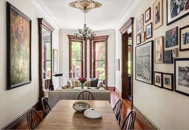 208 Garfield Place, New York City, NY 11215 - dining space featuring a chandelier, plenty of natural light, wood finished floors, and crown molding