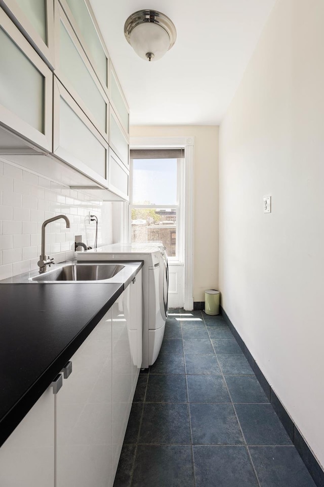 208 Garfield Place, New York City, NY 11215 - laundry area with washing machine and dryer and cabinet space