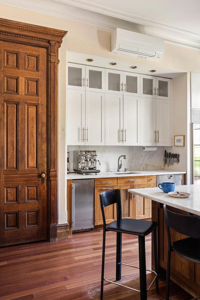 208 Garfield Place, New York City, NY 11215 - kitchen featuring a wall mounted air conditioner, light countertops, refrigerator, crown molding, and dark wood-style flooring