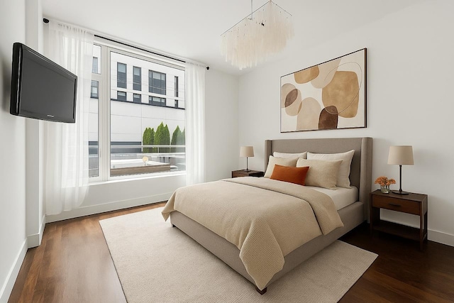 214 N 11th St Unit 1X, New York City, NY 11211 - bedroom featuring dark wood finished floors and baseboards