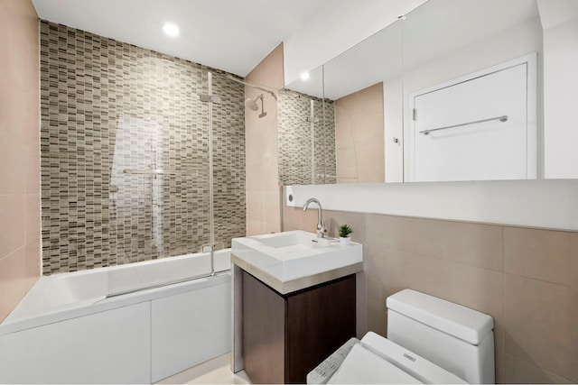 214 N 11th St Unit 1X, New York City, NY 11211 - full bath with tile walls, vanity, bath / shower combo with glass door, and recessed lighting