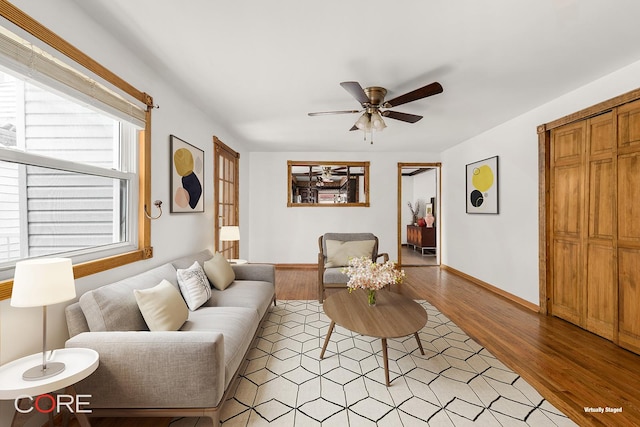 3707 Quentin Rd, New York City, NY 11234 - living area featuring ceiling fan, light wood-style floors, and baseboards