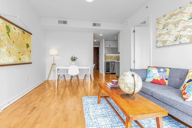 500 4th Ave Unit 5F, New York City, NY 11215 - living area with light wood-style flooring, baseboards, and wine cooler