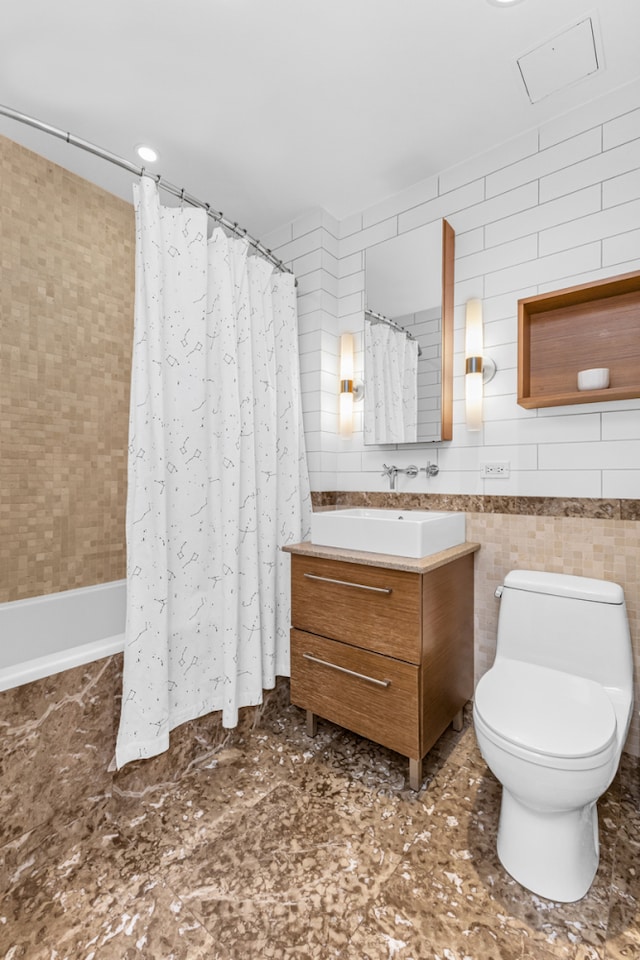 500 4th Ave Unit 5F, New York City, NY 11215 - bathroom featuring tile walls, vanity, toilet, and shower / bathtub combination with curtain