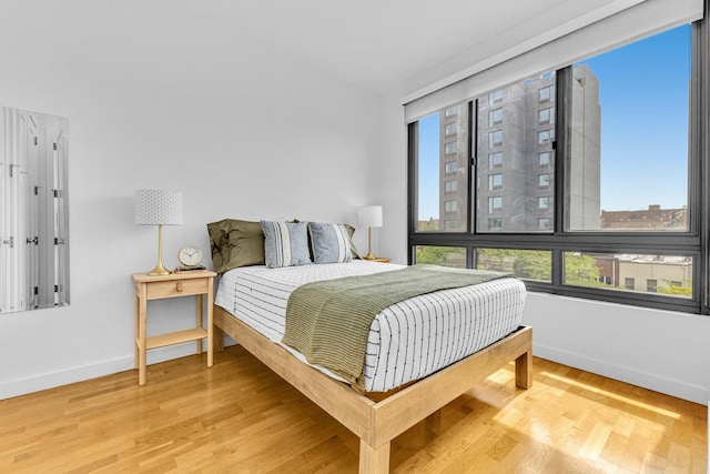 500 4th Ave Unit 5F, New York City, NY 11215 - bedroom with baseboards and light wood-style floors