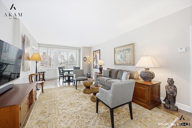 300 E 74th St Unit 15-E, New York City, NY 10021 - living area with baseboards and light wood-style floors