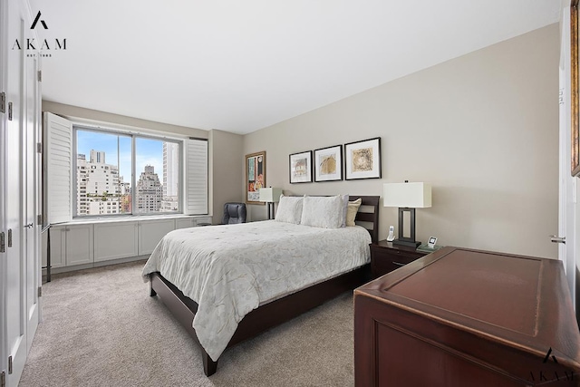 300 E 74th St Unit 15-E, New York City, NY 10021 - carpeted bedroom with a city view