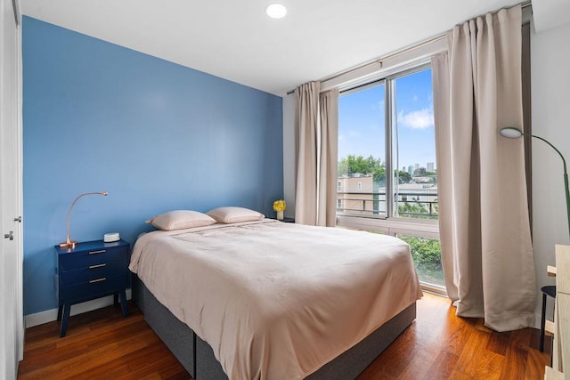 185 13th St Unit 3-B, New York City, NY 11215 - bedroom featuring multiple windows, wood finished floors, and baseboards