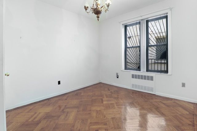 1548 W 8th St, New York City, NY 11204 - unfurnished room featuring radiator heating unit, baseboards, and a chandelier