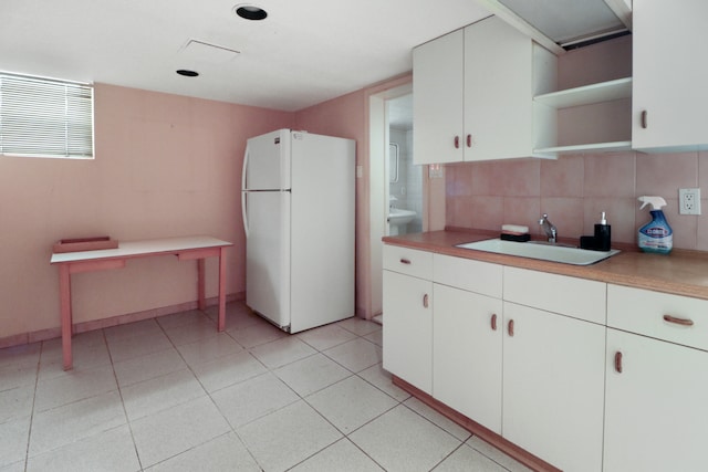 1548 W 8th St, New York City, NY 11204 - kitchen featuring freestanding refrigerator, a sink, open shelves, backsplash, and light countertops