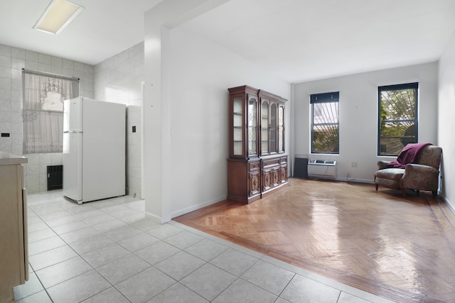 1548 W 8th St, New York City, NY 11204 - sitting room featuring baseboards, a wall mounted AC, and tile walls
