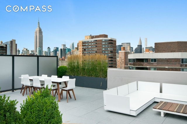 385 1st Ave Unit 6B, New York City, NY 10010 - view of patio with a skyline view and outdoor dining area
