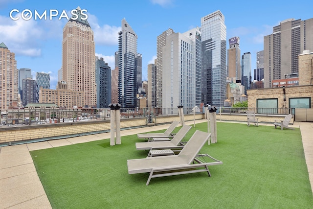 325 W 45th St Unit 700, New York City, NY 10036 - view of home's community with a view of skyline