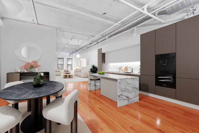 114 Mercer St Unit Unit2, New York City, NY 10012 - dining space with light wood finished floors and rail lighting