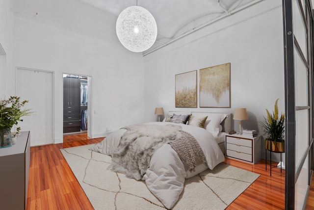 114 Mercer St Unit Unit2, New York City, NY 10012 - bedroom with a towering ceiling and wood finished floors